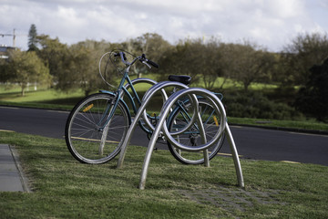 Fototapeta na wymiar Bicycle locked to a bike rack in the Domain, Auckland, New Zealand.