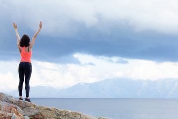 The woman raised her hands