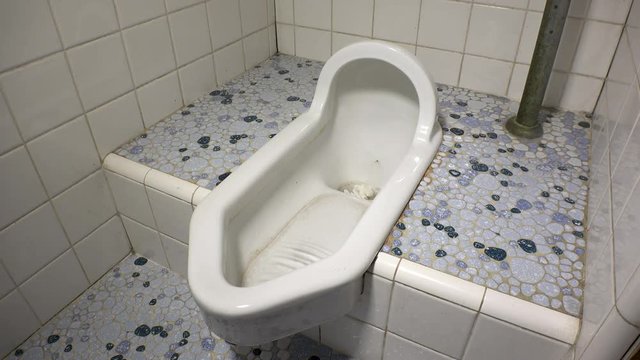 JAPANESE OLD STYLE SQUAT TOILET.