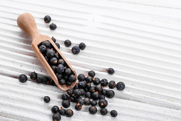 dried juniper berries on a white background