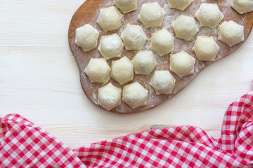 Tablecloth in a cage on a wooden table