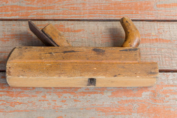 old wooden plane on a bench