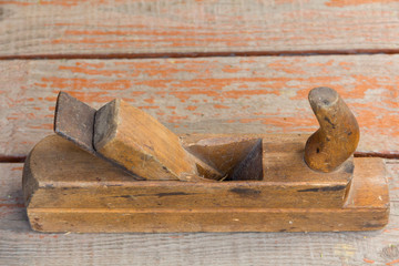 old wooden plane on a bench