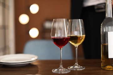 Glasses with tasty wine on table in restaurant