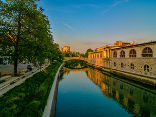 Romantic Ljubljana's city center: river Ljubljanica, Triple Bridge (Tromostovje), Preseren square and Franciscan Church of the Annunciation; Ljubljana, Slovenia, Europe.