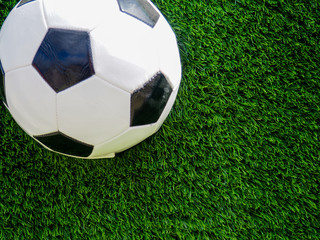Traditional soccer ball on soccer field