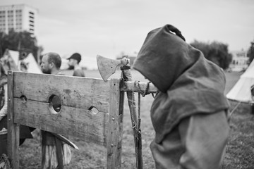The executioner stands near the scaffold