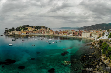 Fototapeta premium Aerial View of Sestri Levante town in Liguria, Italy. Scenic Mediterranean riviera coast. Historical Old Town with colorful houses and sand beach at beautiful coast of Italy.