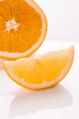 oranges and juice on a white background