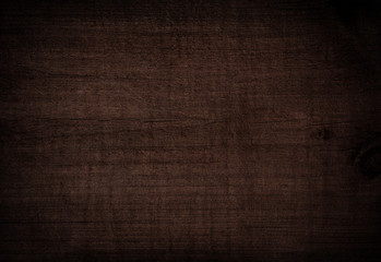 Grunge dark brown scratched wooden cutting, chopping board. Wood texture.