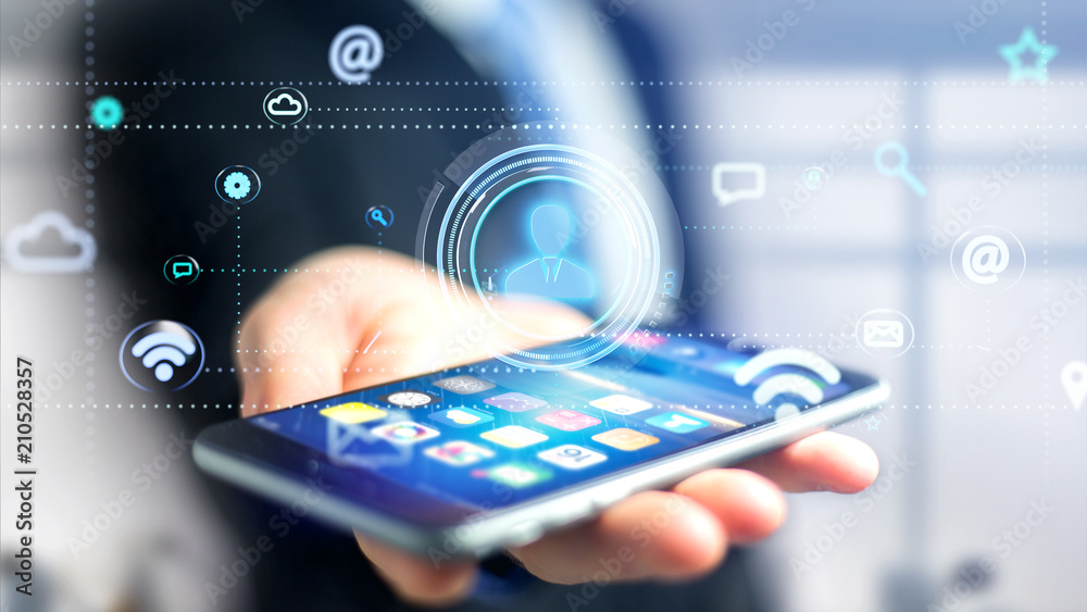 Wall mural businessman using a smartphone with a contact icon surrounding by app and social icon - 3d render