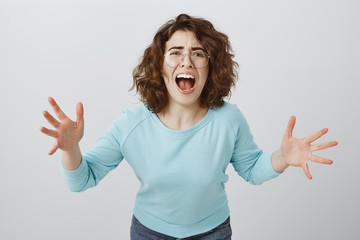 How could you betray my trust. Portrait of desperate miserable woman with curly hair in trendy...