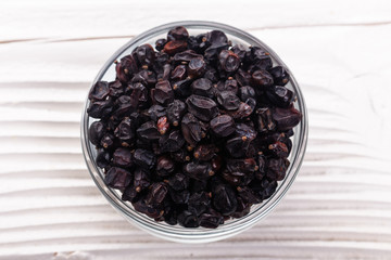 dried barberry berries on the rustic background