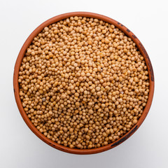fragrant grains of mustard on a white background