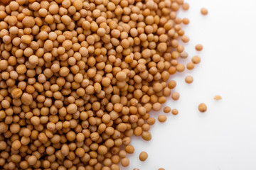 fragrant grains of mustard on a white background