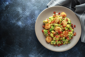 Fried scallops with mash potato, green peas and bacon