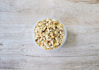 close up  top view muesli in bowl on wooden background, granola healthy meal, food diet concept