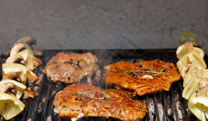meat with  herbs grilling on barbecue