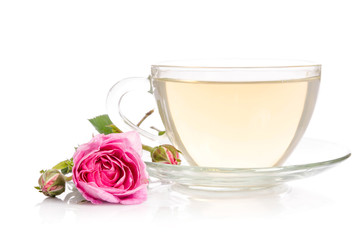 Glass cup of Tea with rose isolated on white background