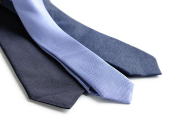 Different men's neckties in blue tones isolated on white background