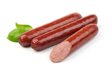 Smoked sausages with fresh herbs, isolated on white background.