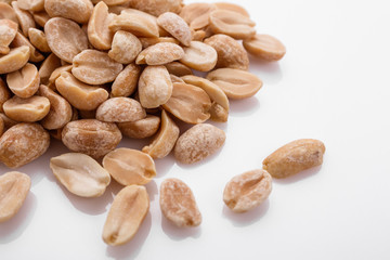 fresh peanuts on a white acrylic background