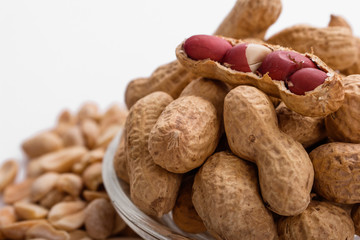 fresh peanuts on a white acrylic background