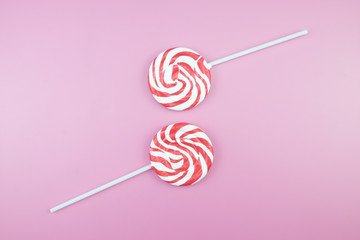 Flat lay top view tasty appetizing concept, minimal Sweet Treat Swirl Candy Lollipop marshmallow...
