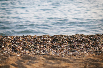 Pebble beach and blue sky on background
