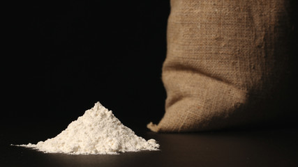 White flour heap near a sac