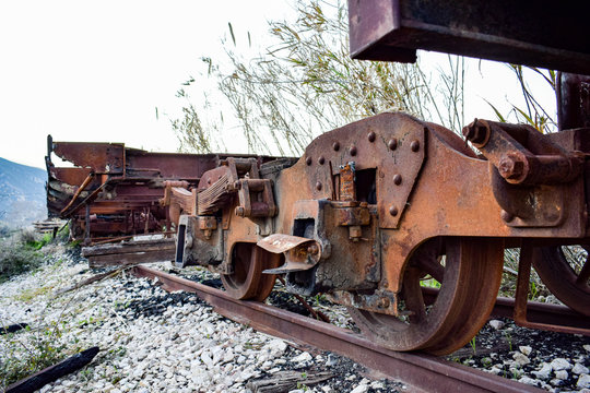 Old rusty train wheels from abandoned old train wagons, at an old railway, photo from a low angle