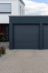 modern black garage in suburban street