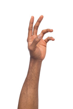 Hand of black man reaching virtual object, isolated on white