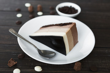 Triple chocolate layer mousse cake with glaze