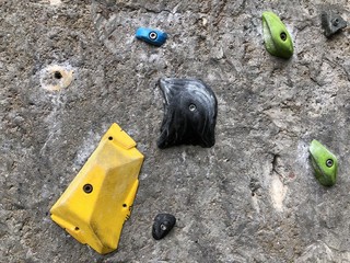 Part view of a climbing wall with bolted handles