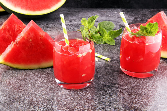 Tasty fresh appetizing watermelon drink smoothie. Watermelon drink in glasses with slices