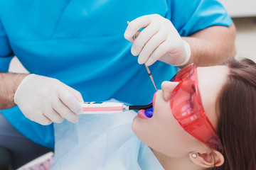 doctor orthodontist examines the patient after brushing his teeth