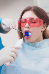 doctor orthodontist examines the patient after brushing his teeth