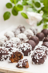 Vegan sweets made from prunes, dates, almonds, sesame, nuts, hazelnuts, nuts, chocolate, goji berries