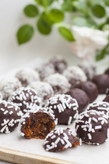 Vegan sweets made from prunes, dates, almonds, sesame, nuts, hazelnuts, nuts, chocolate, goji berries