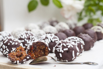 Vegan sweets made from prunes, dates, almonds, sesame, nuts, hazelnuts, nuts, chocolate, goji berries