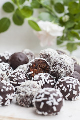 Vegan sweets made from prunes, dates, almonds, sesame, nuts, hazelnuts, nuts, chocolate, goji berries