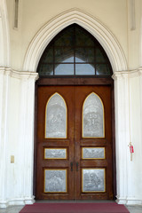 Brown door of church in  Ratchaburi,Thailand