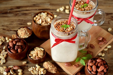 Protein cocktail with peanuts in a glass jar