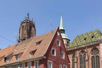 Fototapeta premium view to old half timbered houses and church Saint George in Selestat