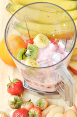 yogurt with banana ,kiwi fruit and strawberry in the blender