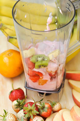 yogurt with banana ,kiwi fruit and strawberry in the blender