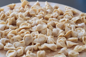 tortellini homemade laid on cutting board