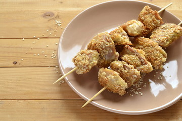 Chicken skewers in sesame breading, copy space