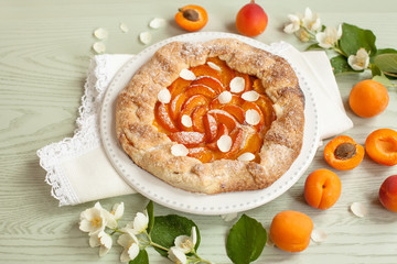 Biscuit with apricots on a wooden background
